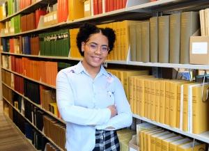 Lorenny Arias Diroche tell us your story in library stacks