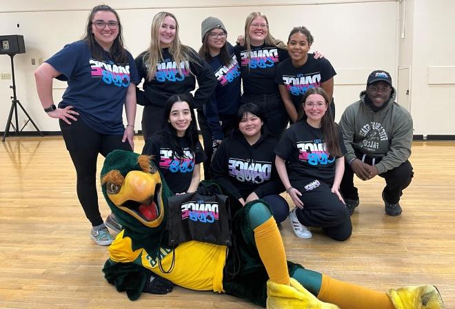 Group photo of dance team with Freddy in dance studio